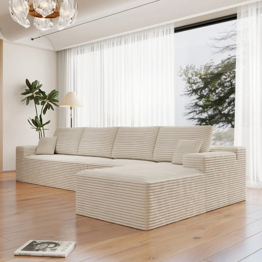 Modern white sofa in a bright living room with large windows.