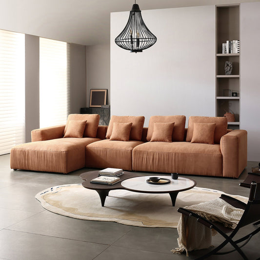 Modern caramel modular sectional sofa in a contemporary living room.